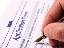 photo of someone filling out an application